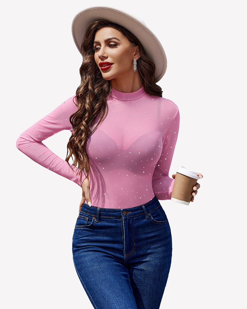 Pink mesh rhinestone sheer top with long sleeves, round neck, and blue jeans - perfect party outfit