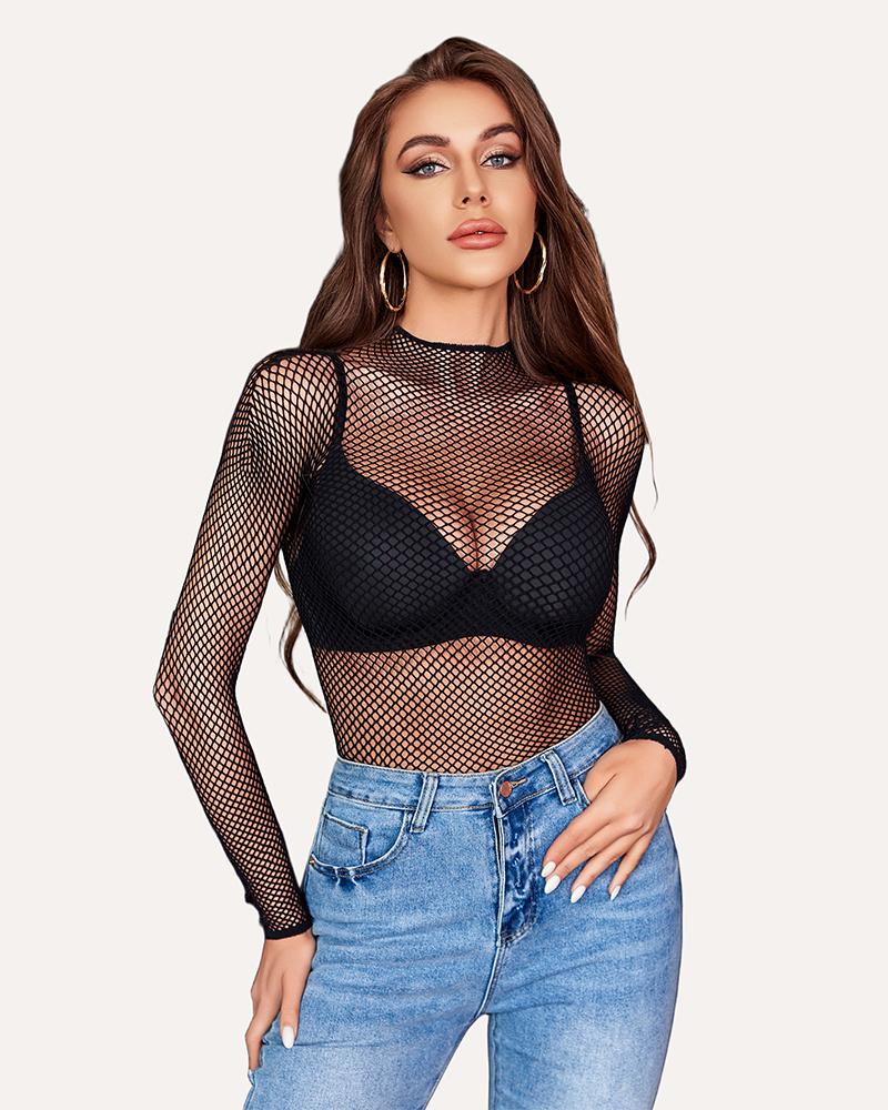 Black fishnet mesh long sleeve top with black bra and blue jeans. Sheer party top.