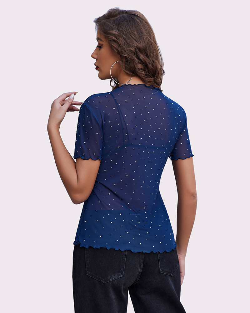 Navy blue mesh rhinestone short sleeve top, ruffle hem, black jeans. Sexy lingerie.