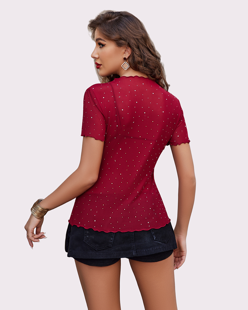 Red mesh rhinestone short sleeve top with ruffle hem and black denim shorts. Sexy lingerie.