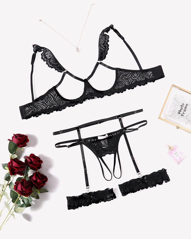 Black floral lace lingerie set: bra, garter belt, and g-string. Perfect for a romantic night.