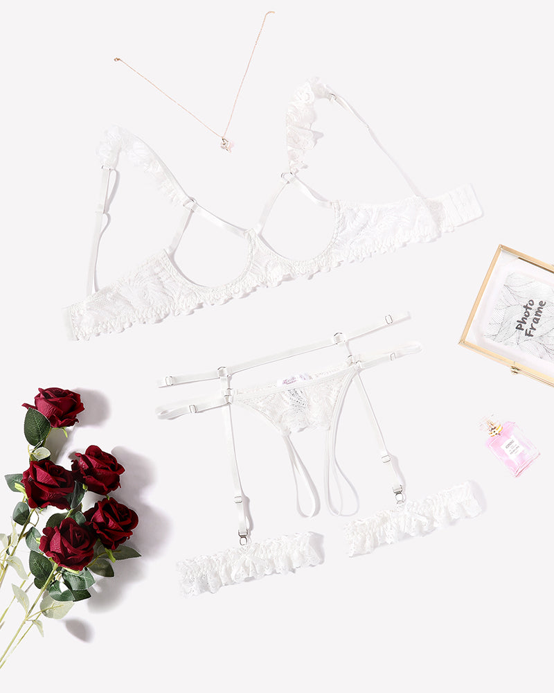 White floral lace lingerie set with garter belt, bra, and panty, perfect for a romantic night
