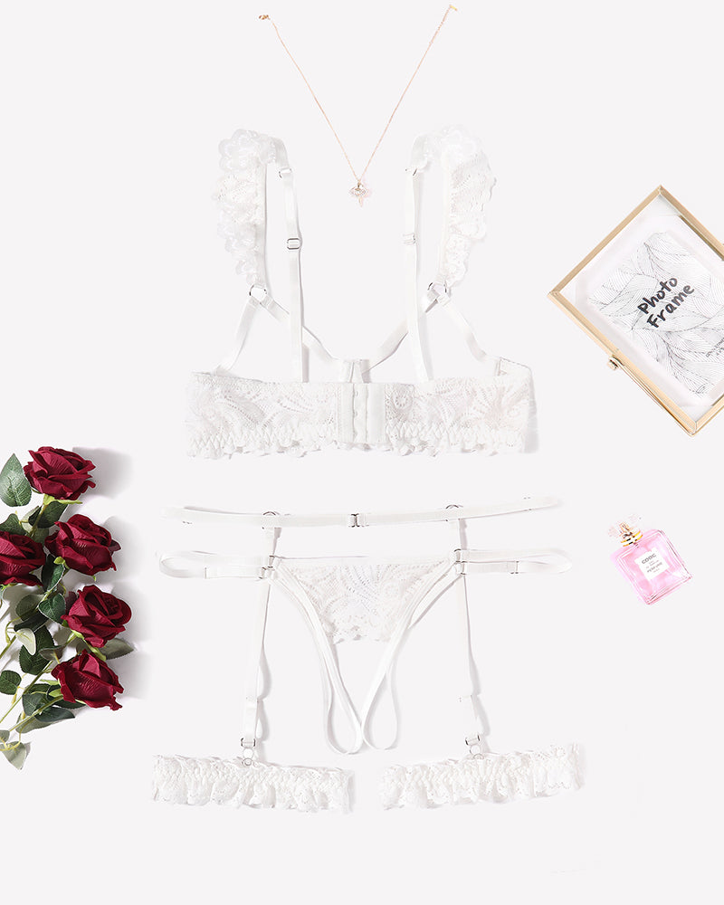 White floral lace lingerie set with garter belt, bra, and panty, perfect for a romantic night.