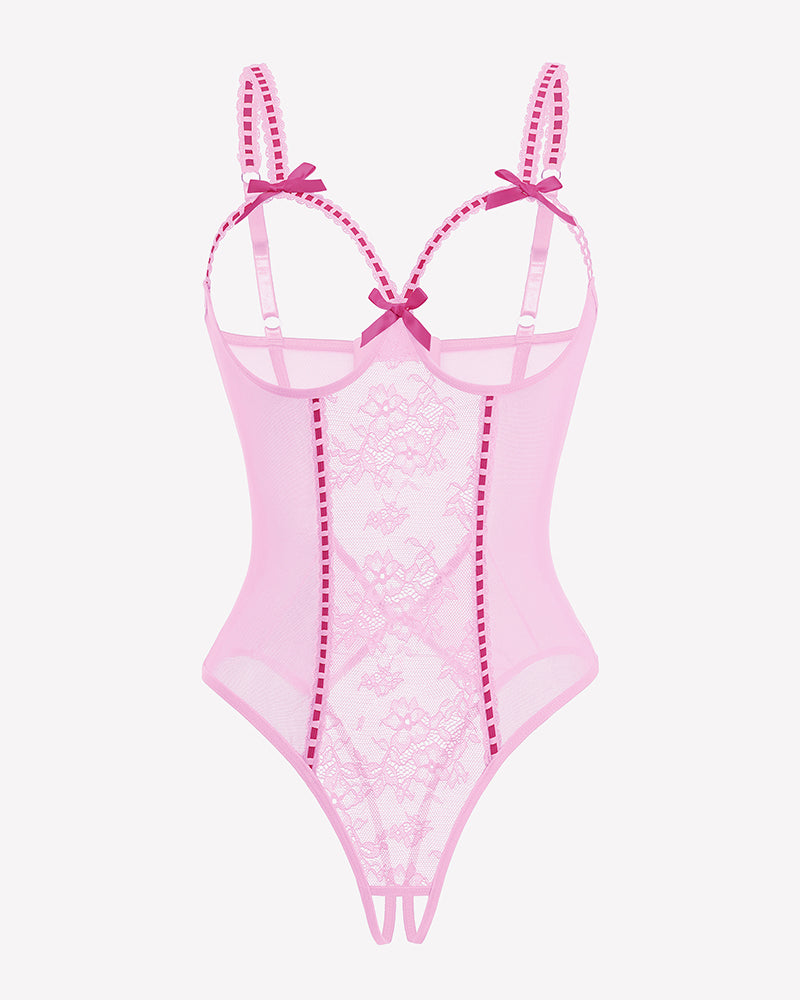 Crotchless lace mini teddy bodysuit in pink with sheer mesh and lace-up straps