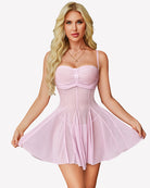 Light pink mesh babydoll dress with ruched bust and flared pleat skirt, spaghetti straps