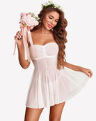 Light pink mesh babydoll dress with draped pleats and bow bodice, thin straps