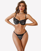 Black lace underwire bra and thong-style panty set with sheer details and trim.