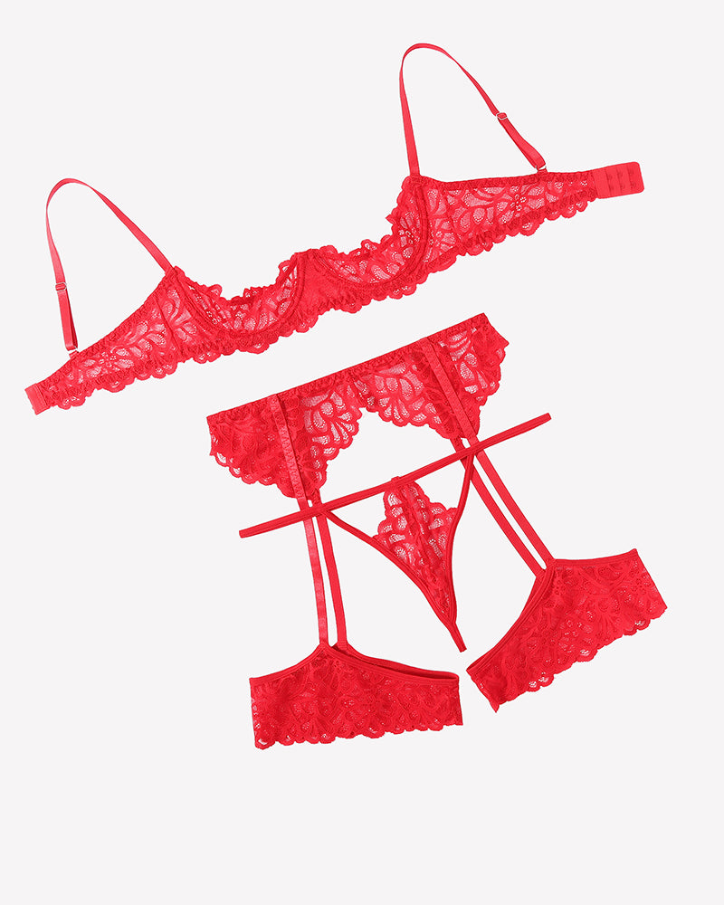 Red lace lingerie set flat lay: bra, thong, and garter belt