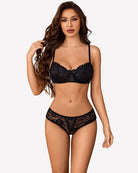 Black floral lace boyshort panties with hollow-out center and scalloped lace trim.