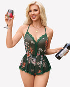 Green floral mesh cami romper with lace V neckline and lace-trimmed ruffle hem