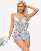 Light blue floral cami romper with lace V neckline and ruffled shorts hem