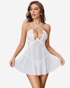 White lace babydoll dress with crisscross halter straps and sheer flared skirt