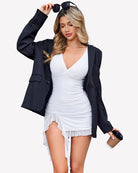 White ruched bodycon mini dress, sleeveless deep V and layered ruffle hem