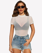 White sheer mesh top with V-shaped yoke, short sleeves, mock neck.