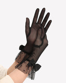 Black mesh short glove with bow ribbon and polka-dot cuff detail on wrist