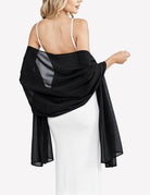 Black sheer chiffon shawl scarf wrap with flowing drape and gathered twist at shoulder