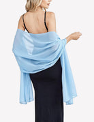 Light blue sheer chiffon shawl scarf wrap with flowing drape and gathered twist at shoulder