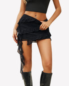 Black ruffle tie mini skirt with tiered frills and long sheer side tie