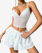 White lounge set with V-neck cami and tiered ruffle mini skirt