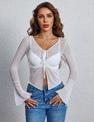 White sheer mesh crop top with a tie front, deep neckline, and flared bell sleeves