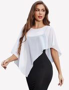 Sheer capelet wrap with batwing sleeves and wide boat neckline, draped over dark dress