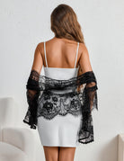 Black lace mantilla veil, back view with scalloped lace trim over shoulders