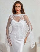 White lace mantilla veil with scalloped edge, draped over shoulders