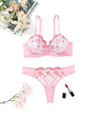Pink embroidered lingerie set with underwire mesh bra and thong, floral embroidery