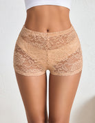 Sheer lace micro shorts, nude floral lace, low-rise elastic waistband.