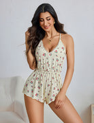 Cream floral romper with a lace-trim V-neck, thin straps and elastic waist.