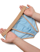 Men's sheer mesh bikini brief, light blue with tan/gold trim, folded detail