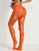 Orange lace fishnet tights with large cutouts, back view