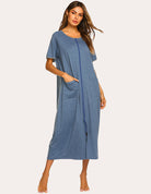 Blue short-sleeve loungewear dress with front zipper, side pockets, and leg-split hem