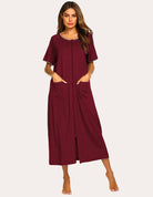 Red short-sleeve loungewear dress with front zipper and side pockets, full length