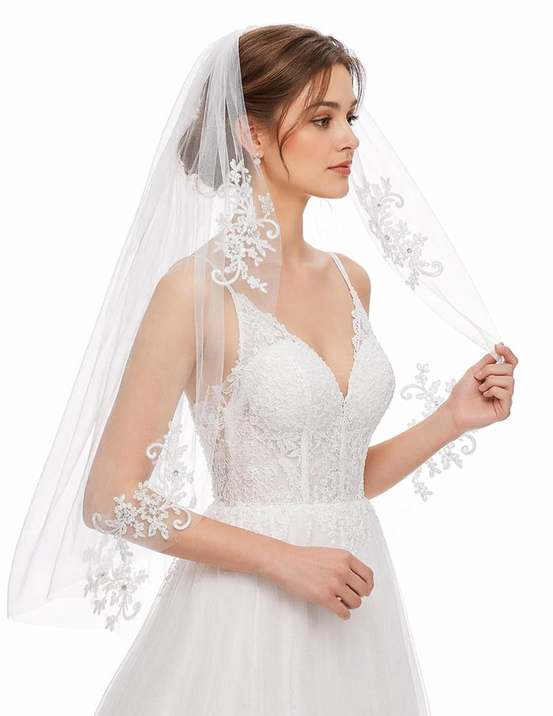 White wedding veil with delicate floral lace edge and sheer shoulder drape