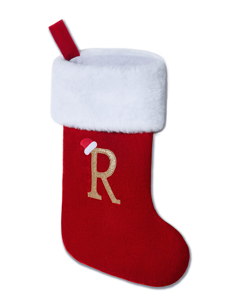 Red velvet Christmas stocking with white plush cuff, red hanging loop, and gold R monogram.