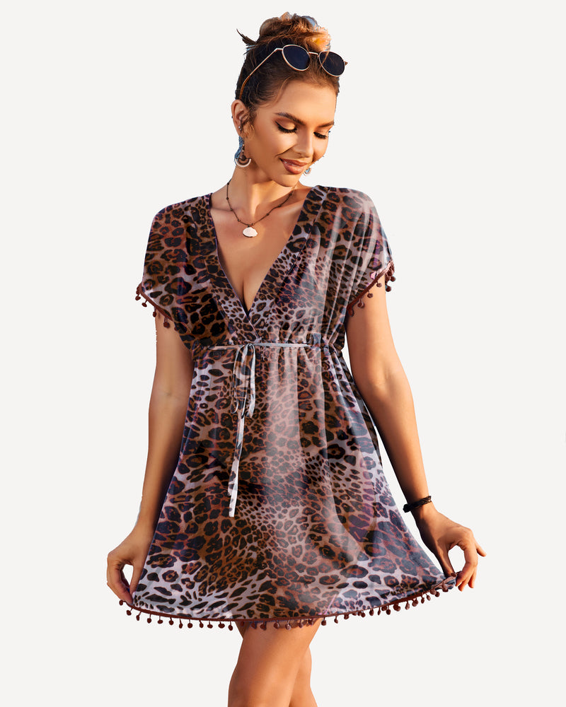 Leopard print swimsuit cover-up with tassels, V-neck and drawstring waist. Perfect beach cover-up.