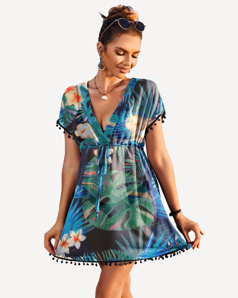 Floral print swimsuit cover-up with deep V-neck and tassel details. Stylish beach cover-up.