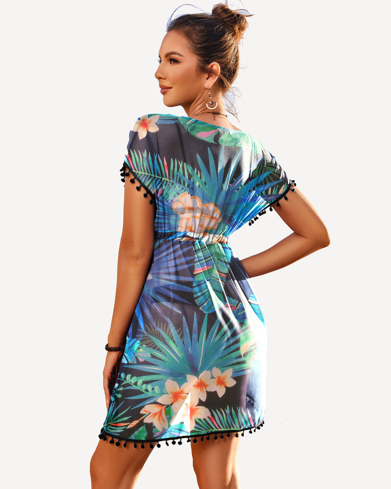 Floral beach cover-up with deep V-neck, tassels and drawstring. Ideal for beachwear.