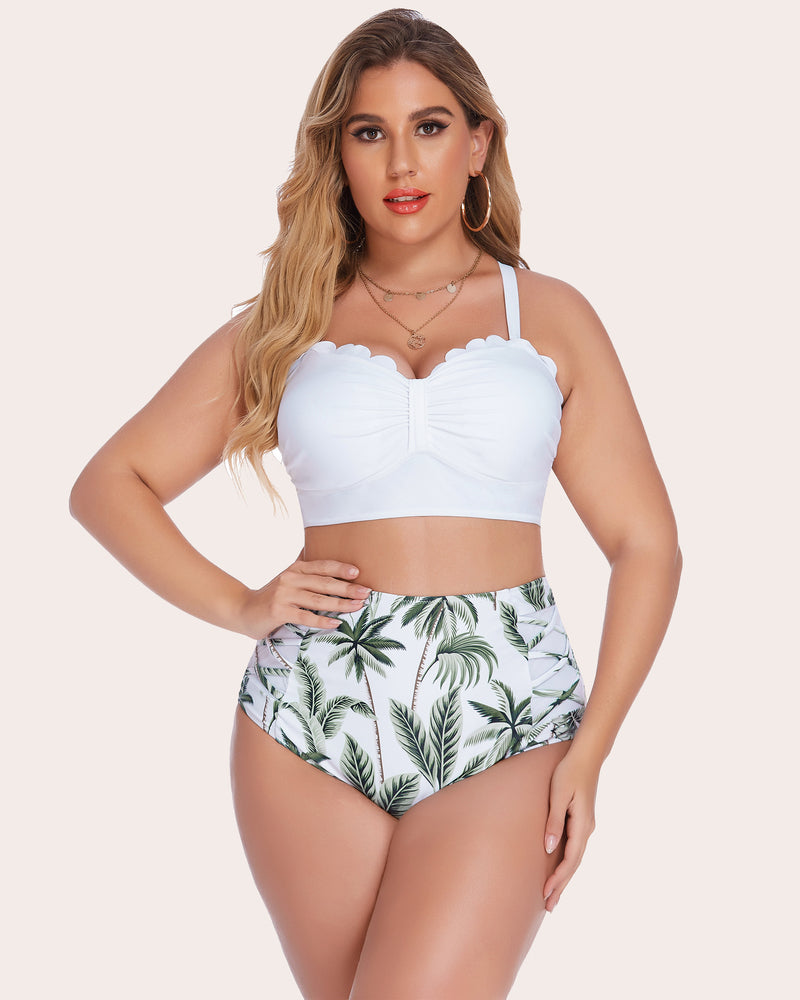 Plus size high-waisted bikini set featuring white scalloped top and palm tree print bottom