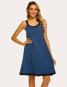 Blue nightdress with black contrast trim, scoop neck, front pleats, sleeveless