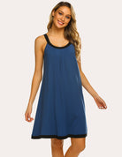 Blue sleeveless nightdress with scoop neck, black trim, and front pleated skirt