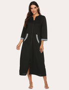 Black 3/4-sleeve zip front nightgown robe with gray cuffs and side pocket openings.