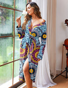 Blue patterned knit bathrobe with V-neck, long sleeves, and waist belt tie