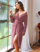 Mauve knit bathrobe with belt tie, kimono sleeves, and contrast piping