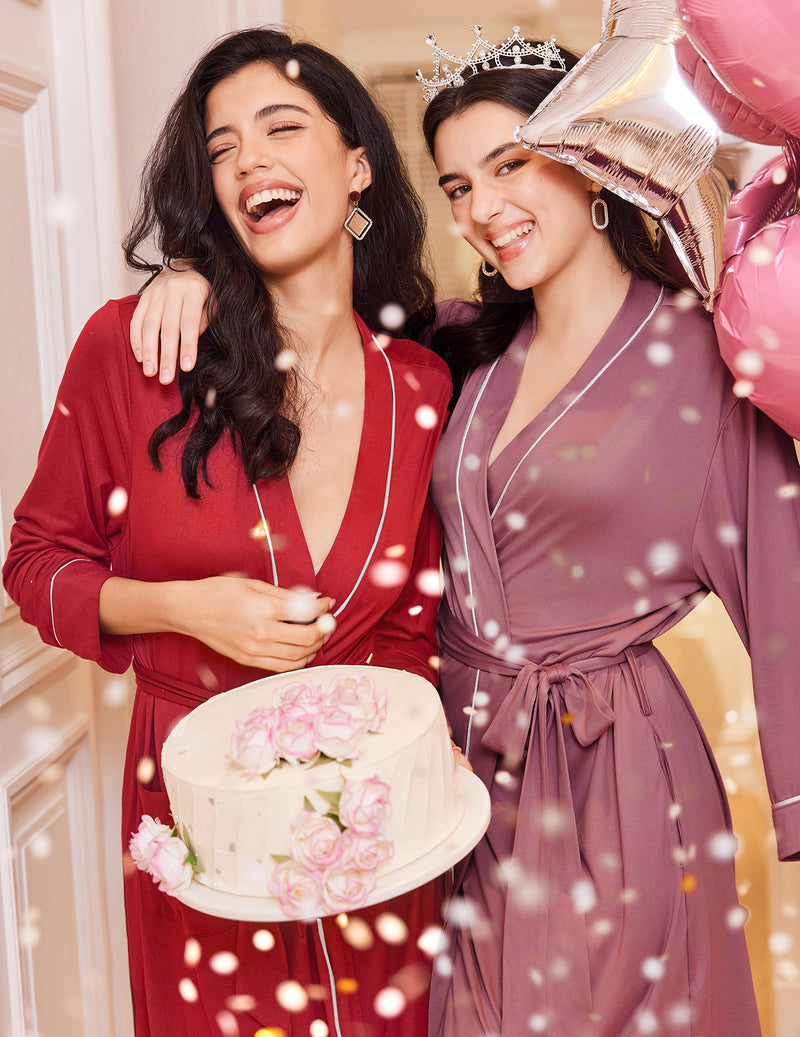 Red and mauve knit bathrobes with V-neck and belt ties, contrast piping