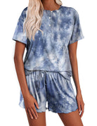 Blue tie-dye pajama set: short-sleeve henley top and drawstring elastic-waist shorts.