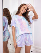 Pastel tie-dye pajama set with short-sleeve button-front top and drawstring lounge shorts.