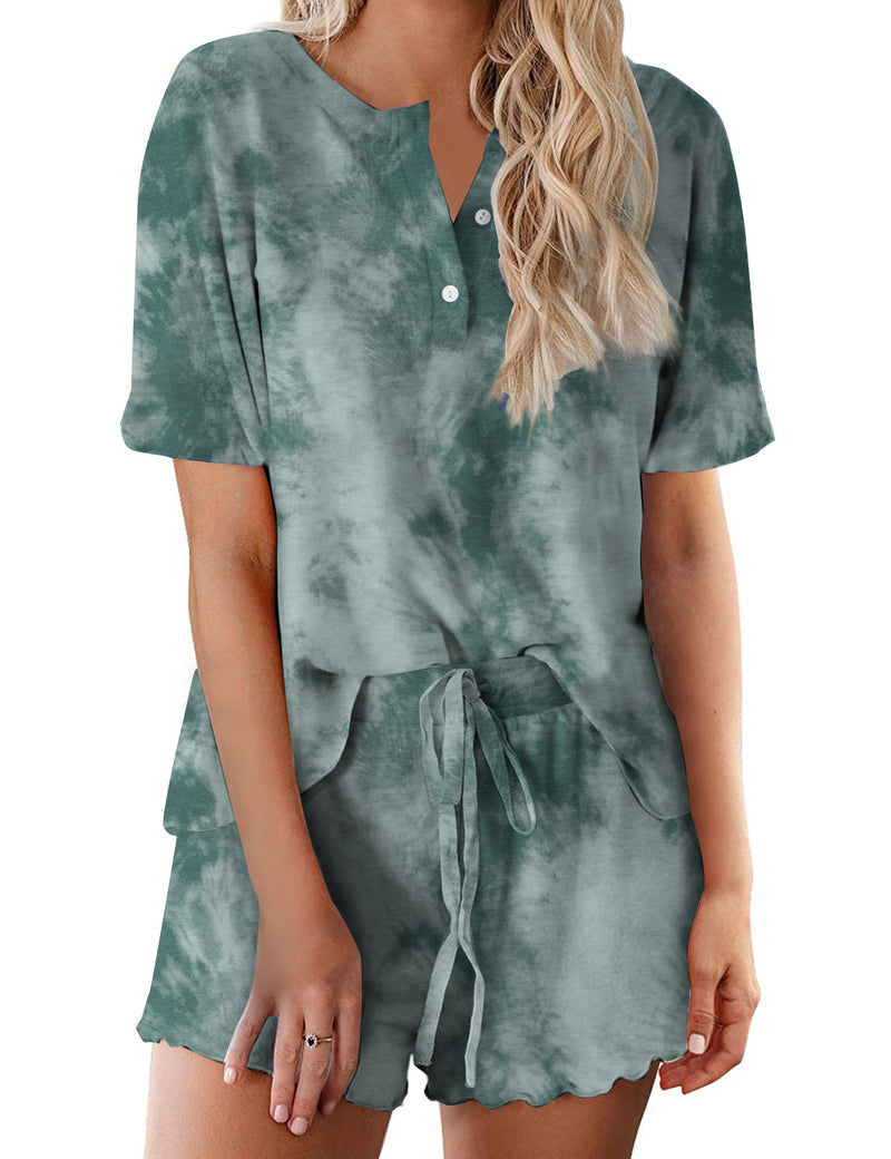 Women’s green tie-dye pajama set with short-sleeve button-up top and matching drawstring shorts
