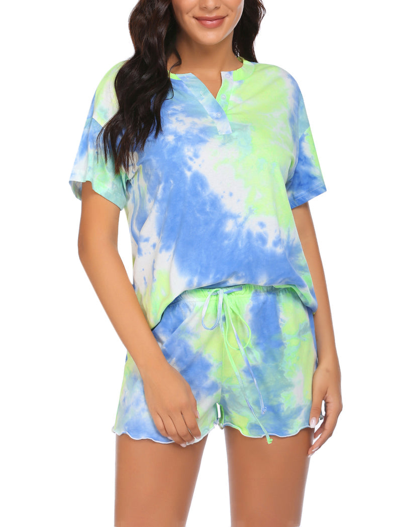 Women’s tie-dye pajama set in light blue with yellow-green accents; short-sleeve button top, drawstring shorts